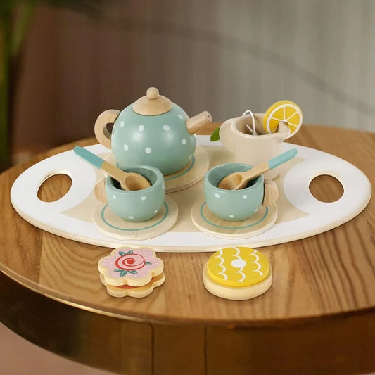 CSSV FILE afternoon tea set with teapot, cups, and saucers arranged on a table for elegant serving.