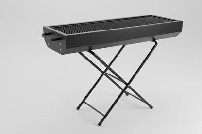 Foldable CSSV FILE charcoal BBQ grill with portable design, compact and ready for outdoor grilling.